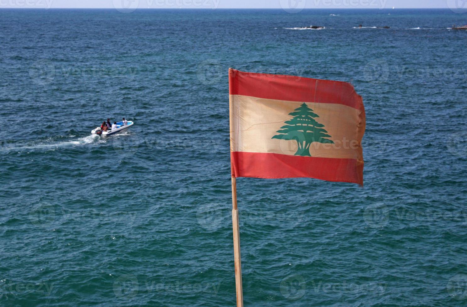 Lebanese flag waving at the coast of Beirut, Lebanon photo