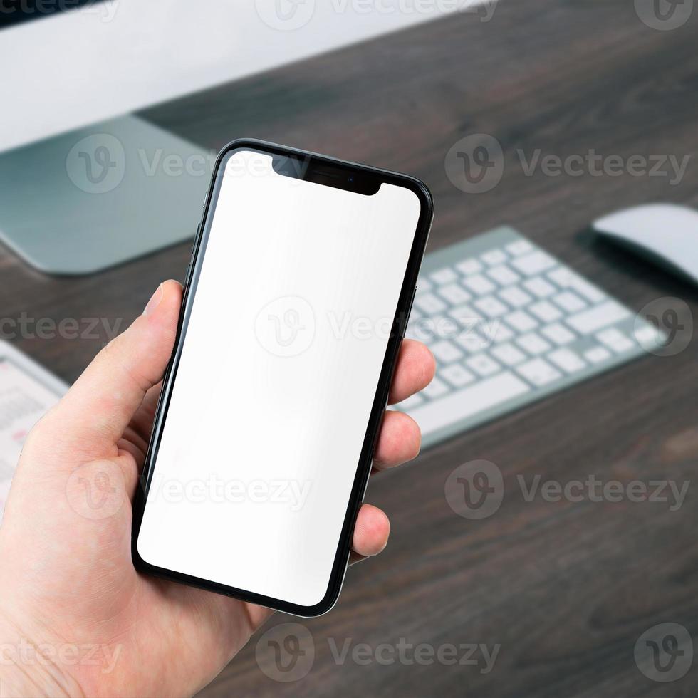 holding phone mockup photo