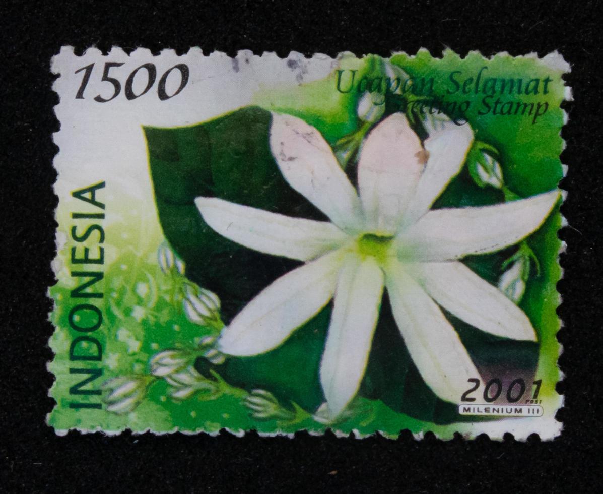 Sidoarjo, Jawa timur, Indonesia, 2022 - Stamp collection philately with white jasmine flower illustration theme photo