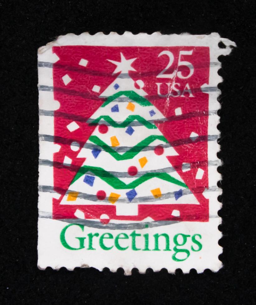 Sidoarjo, Jawa timur, Indonesia, 2022 - Stamp collection philately with the theme of a rhinoceros illustration Christmas tree photo