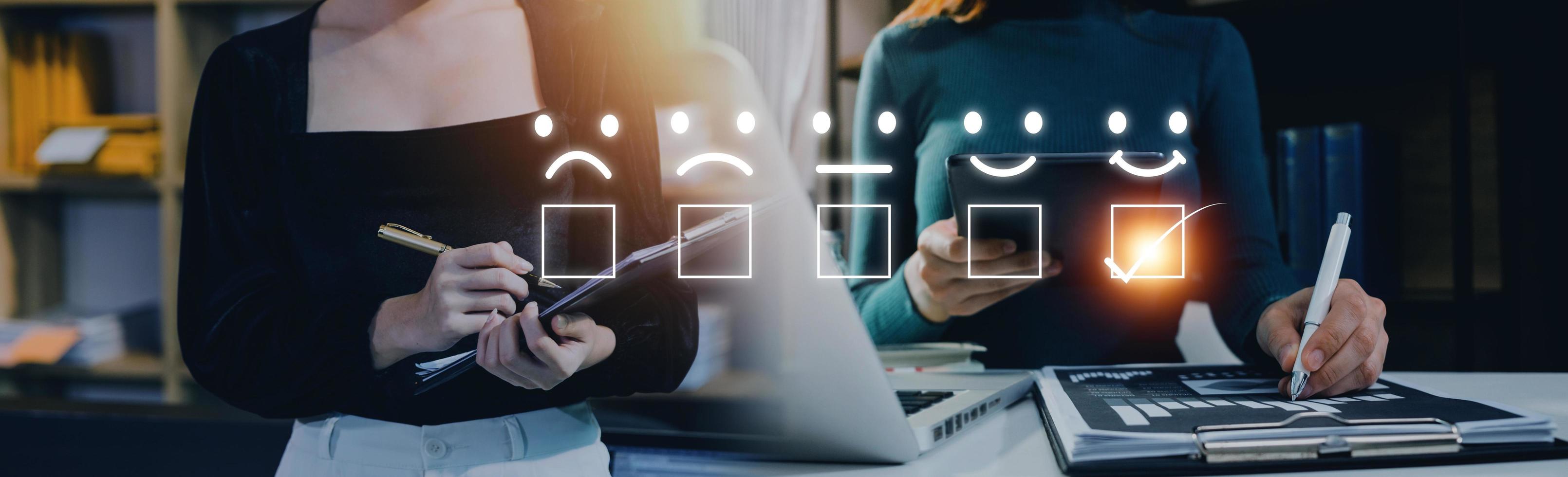 Customer service satisfaction survey concept.Business people or customers show satisfaction through the application on the tablet screen. By giving the most satisfaction rating and 5 stars. photo