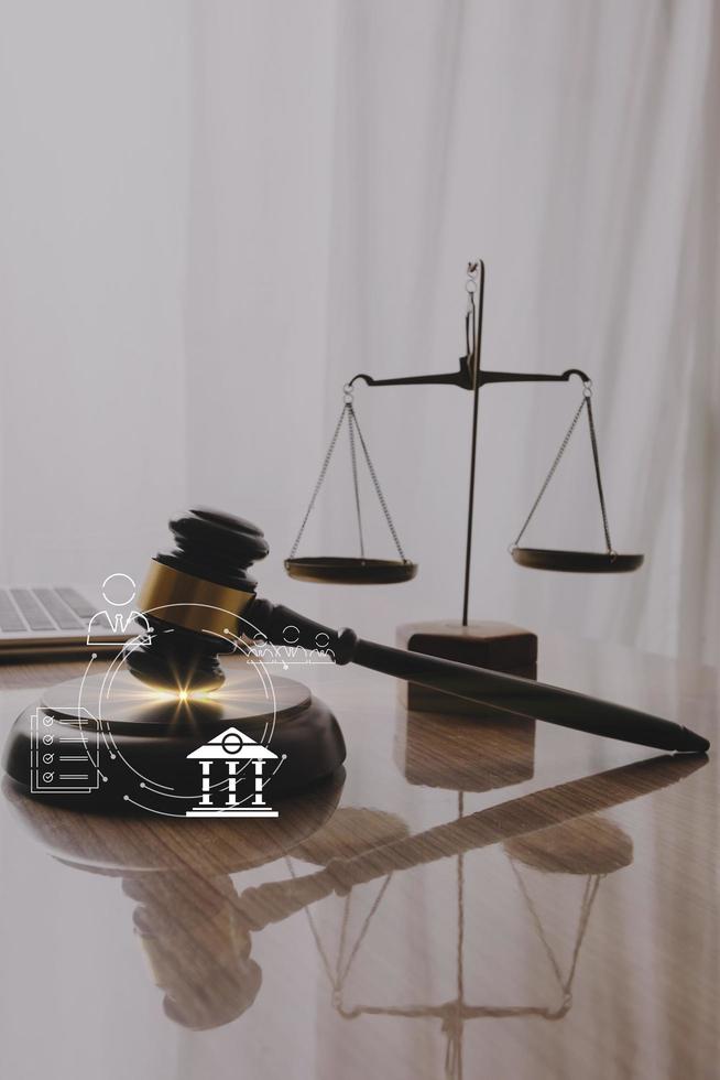 justice and law concept.Male judge in a courtroom on wooden table and Counselor or Male lawyer working in office. Legal law, advice and justice concept. photo