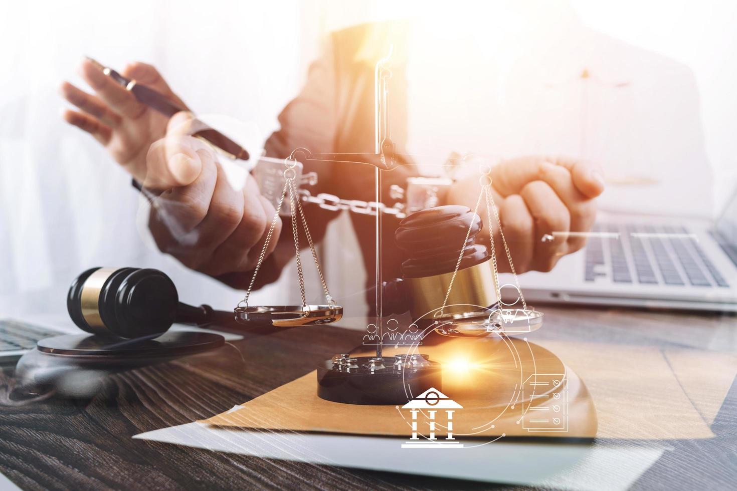 Business and lawyers discussing contract papers with brass scale on desk in office. Law, legal services, advice, justice and law concept picture with film grain effect photo