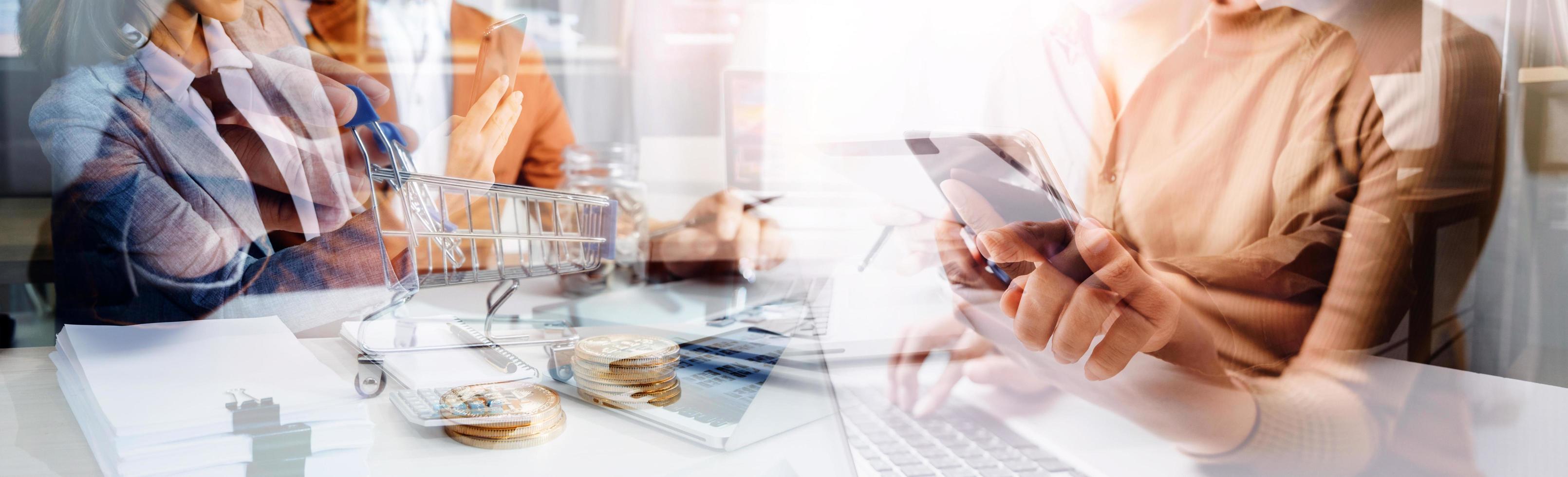 Business team finance or bookkeeper working with a calculator to calculate business data summary report, accountancy document and laptop computer at the office, business meeting concept photo