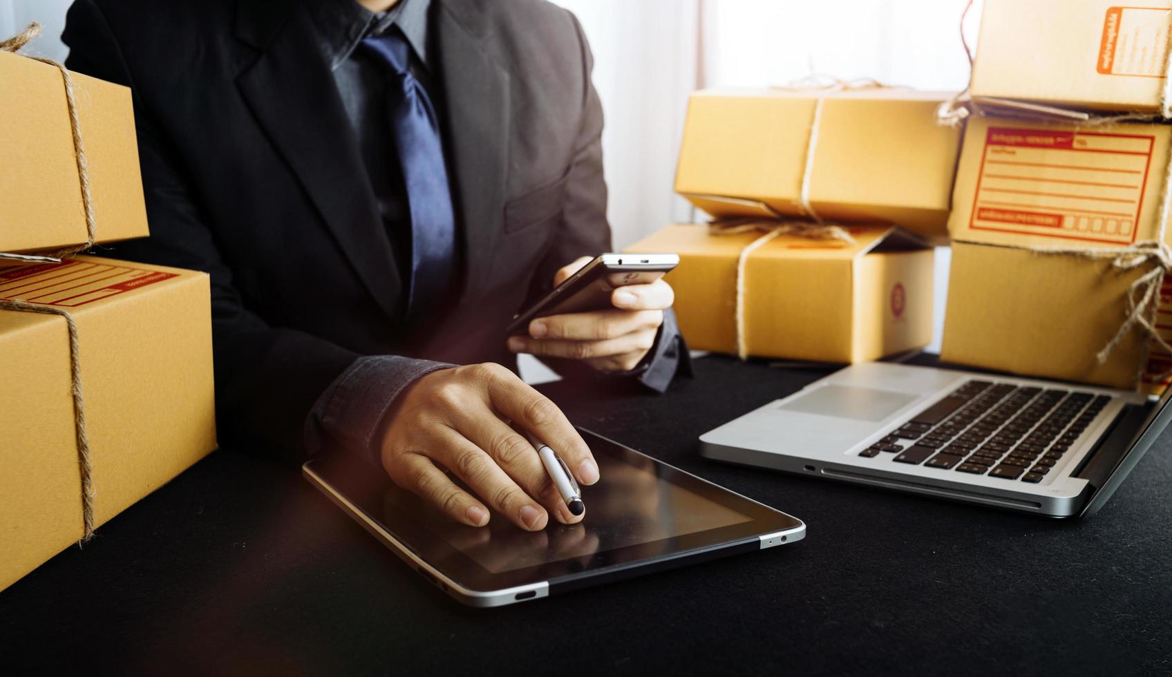 Business woman start up small business entrepreneur SME success .freelance woman working at home with Online Parcel delivery. SME and packaging deliveryconcept photo