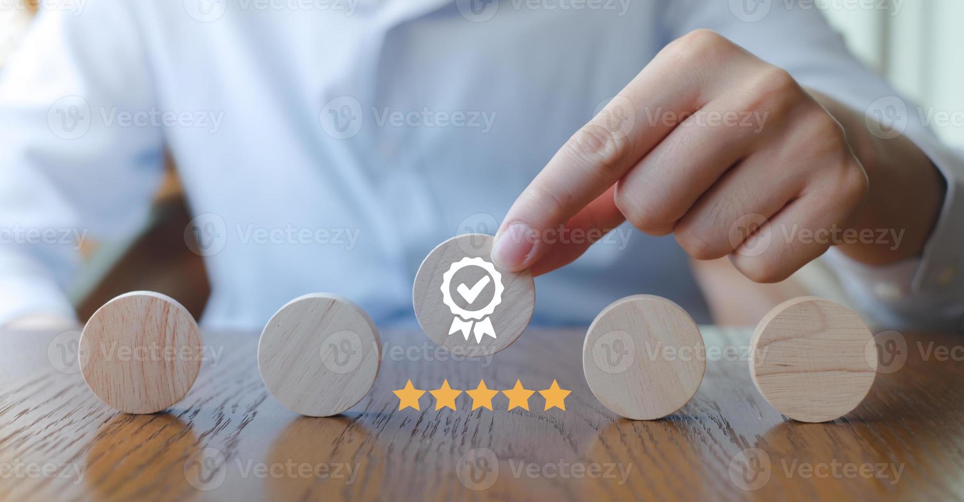Businessman hand holding sign of the top service Quality assurance, Guarantee, Standards, ISO certification and standardization concept, advertising product and service quality commitment. photo