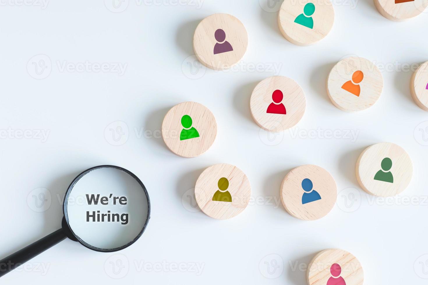 Human resources management and recruitment business hiring concept, professional staff research, head hunter job with magnifying glass. magnifying glass looking for employees on wood cube. photo