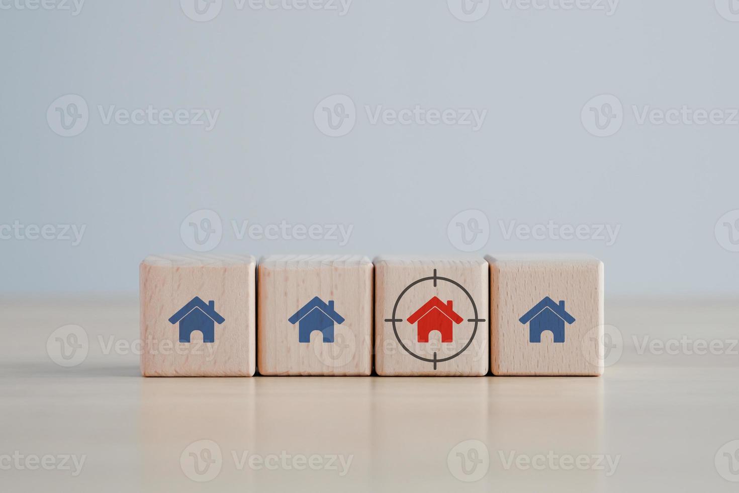 Real estate. House and property investment and asset management concept. Buy, Rent, Interest rates, Loan mortgage, Tax. Red house icon on wooden block with focus frame. Decision for buy or rent home. photo