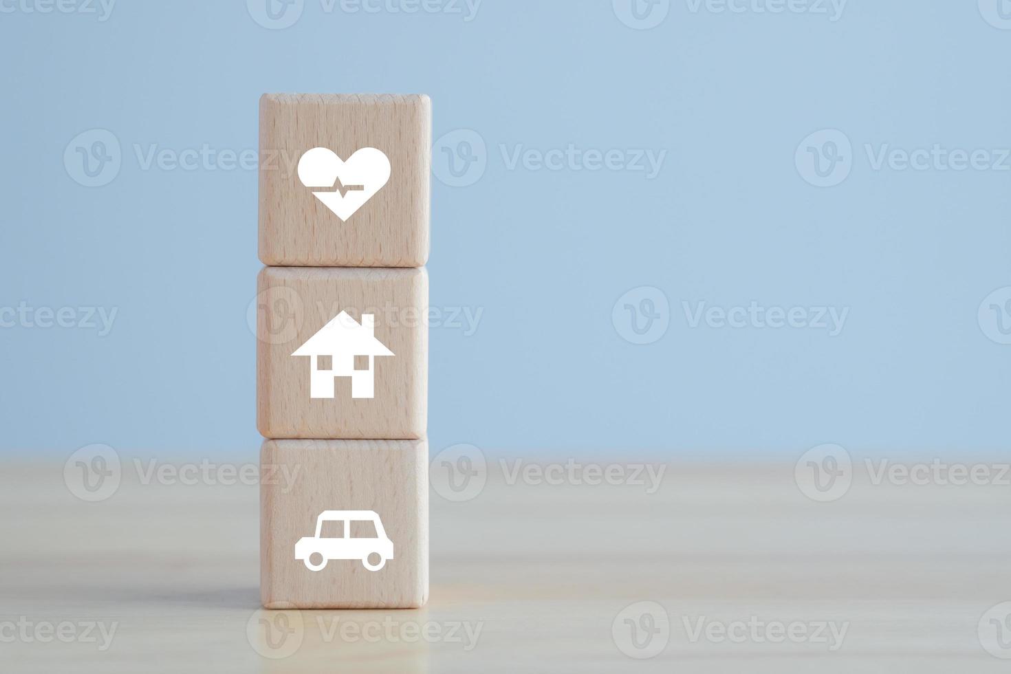 Insurance concept. Goal and target for the best life or protection against a possible eventuality. House , Car and Health icon on wooden block for assurance life concept. photo