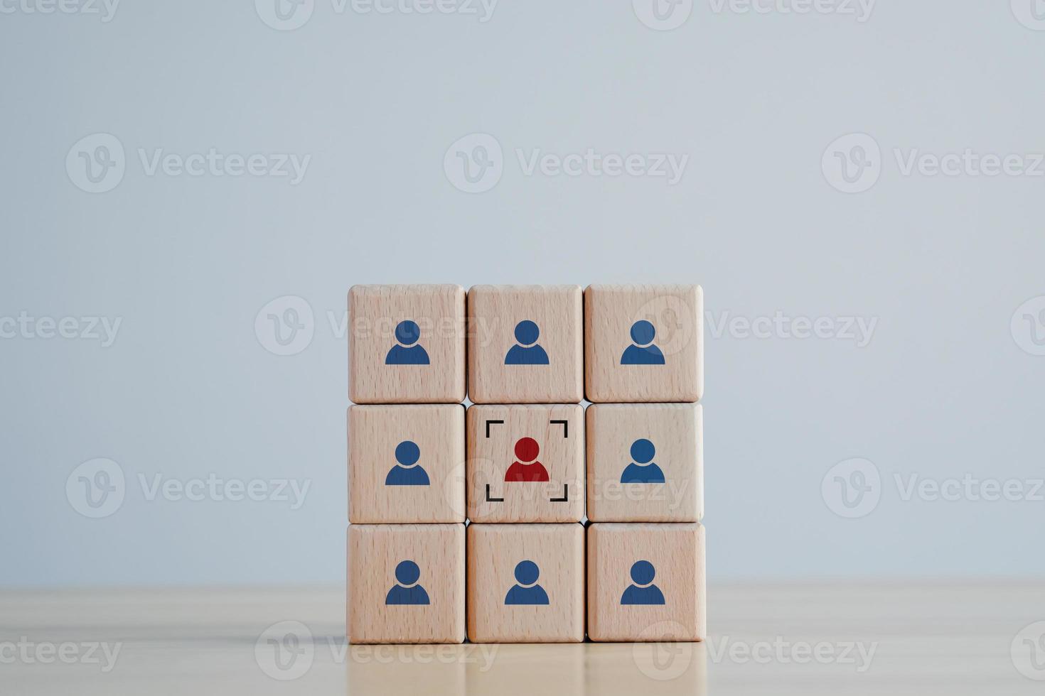 Business hiring and recruitment selection. Career opportunity. Human Resource Management. Focus human icon on wooden block. Choice of employee leader from the crowd. photo