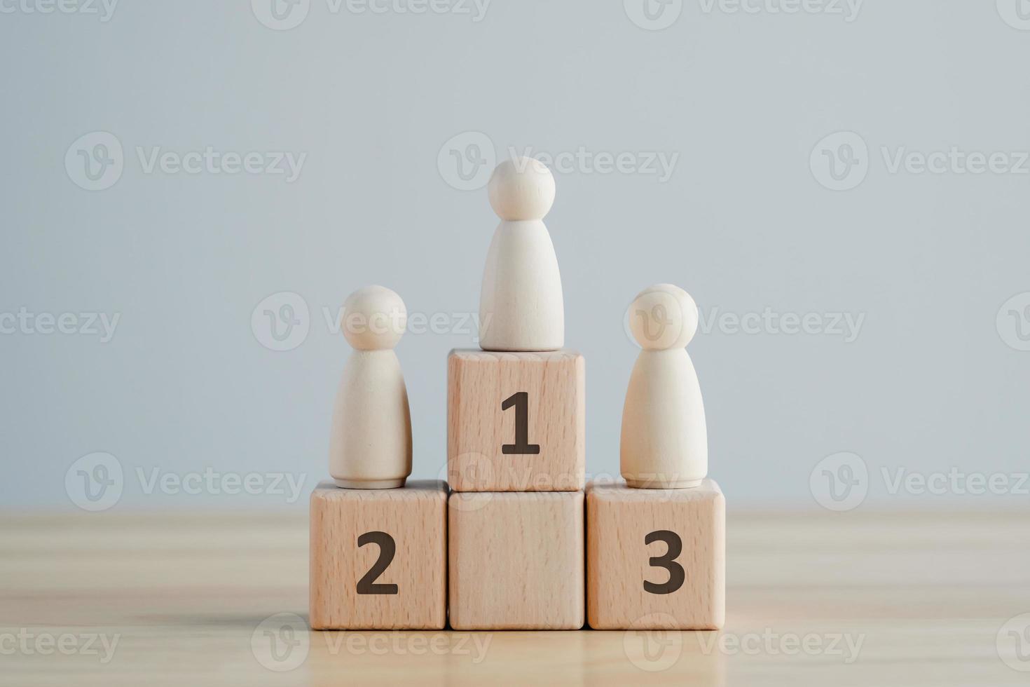 Wooden human standing on podium with ranking for winner business and sport competition concept. Human resource, Talent management, Recruitment employee, Successful business team leader concept. photo