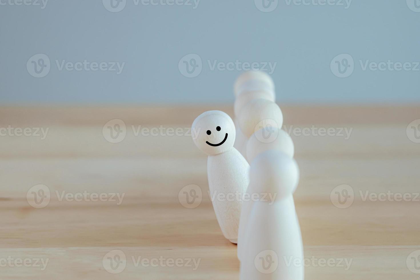Individuality. Unique. Happy and enjoy stand out from group. Smiling figure among many crowd. Human development. Psychology Personality Concept. photo