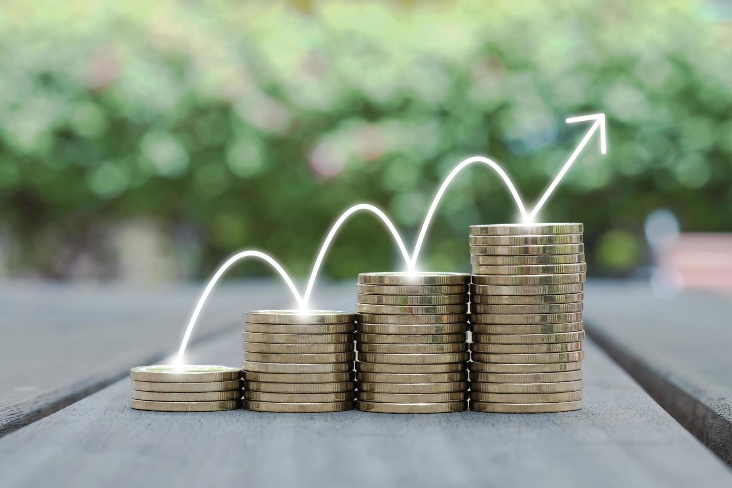 Coin stack growing with line arrow up. Financial and investment concept. Graph and rows of coins for finance and business. photo