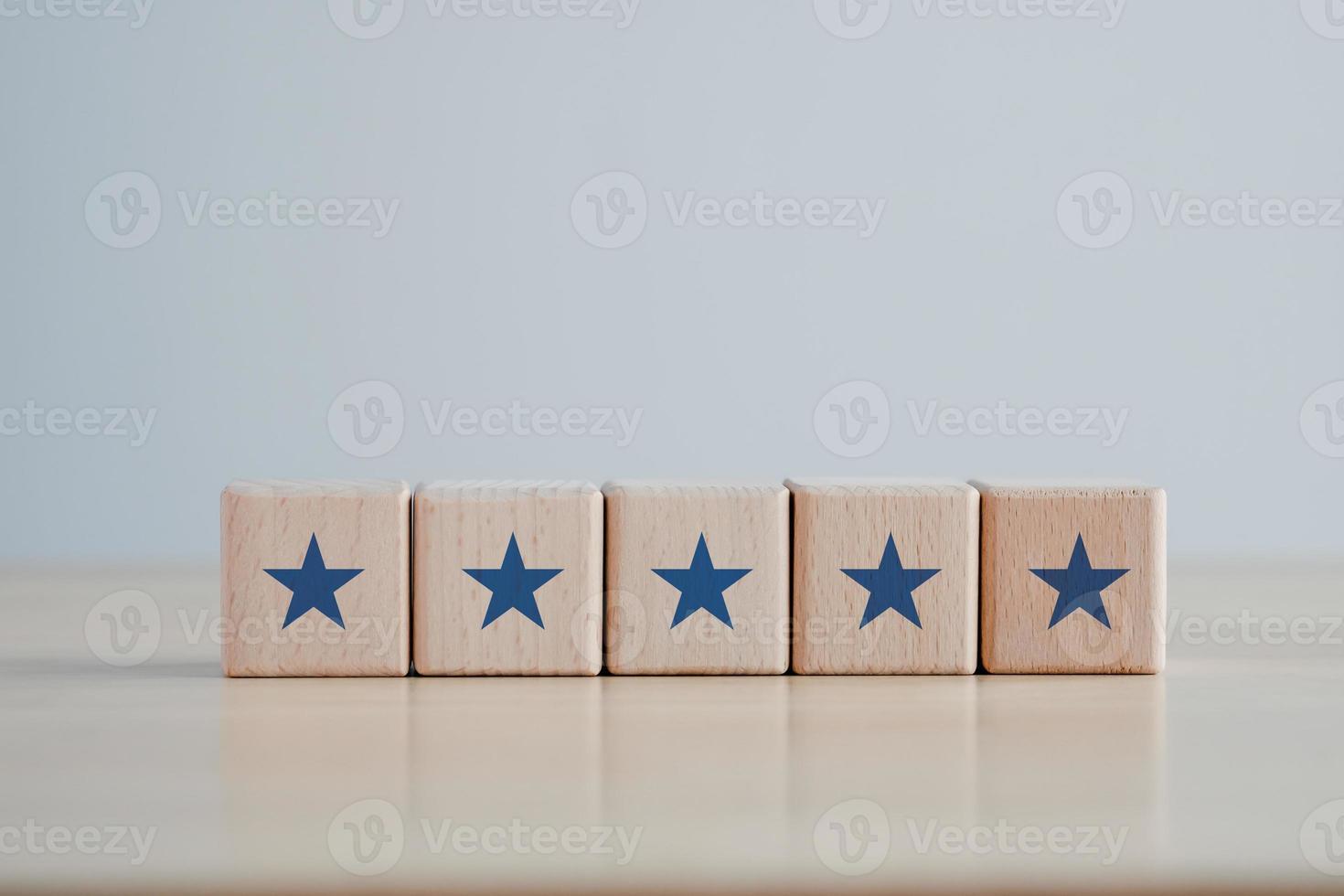 Five star on Wooden block cube shape. Satisfaction, Feedback, Review, The best excellent business services rating customer experience concept. photo