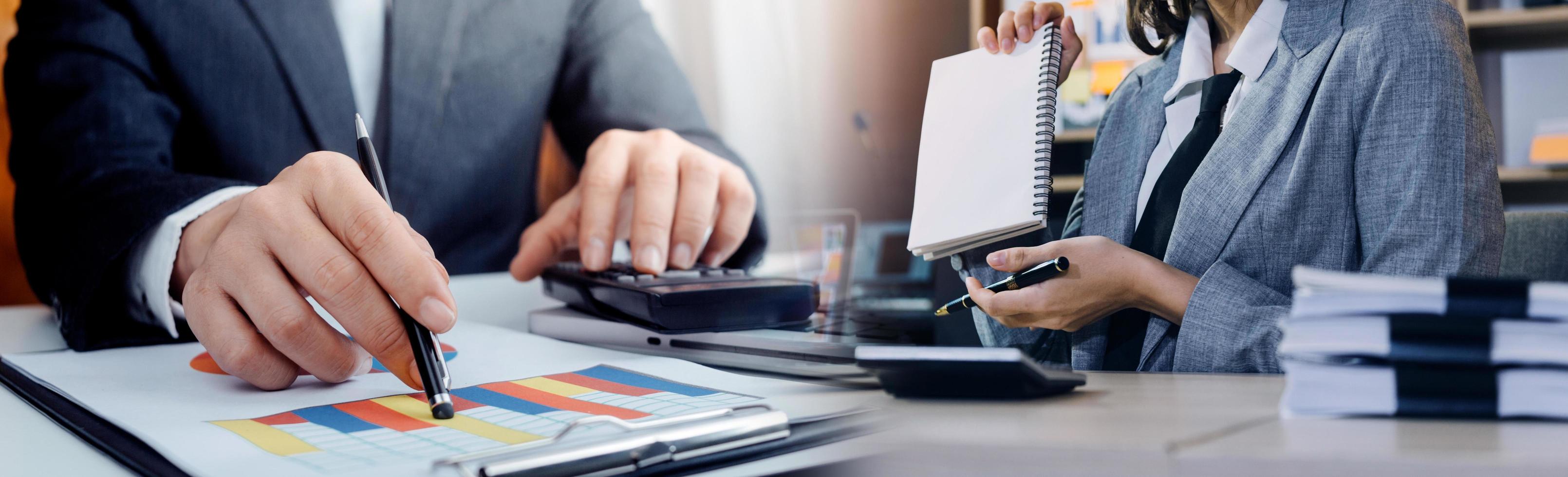 Business team finance or bookkeeper working with a calculator to calculate business data summary report, accountancy document and laptop computer at the office, business meeting concept photo