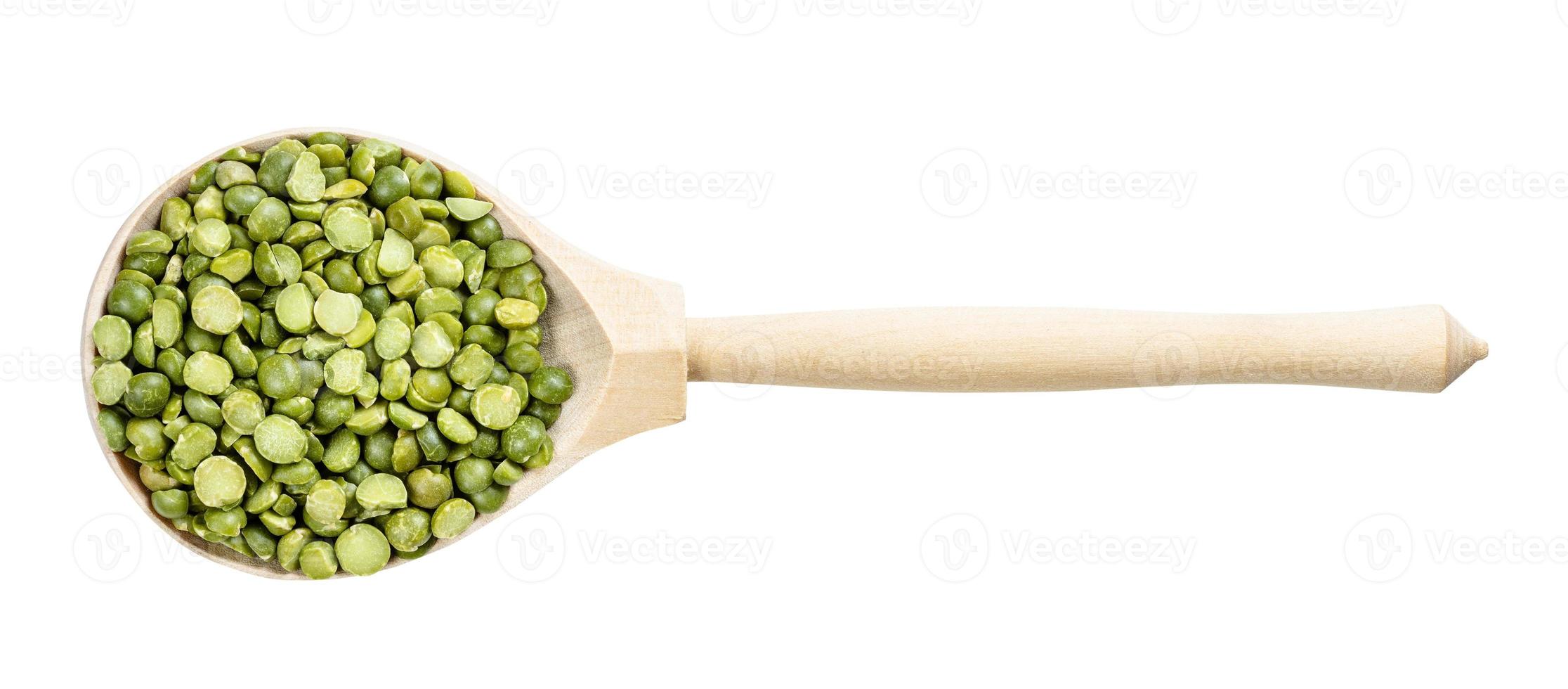 top view of wood spoon with green split peas photo