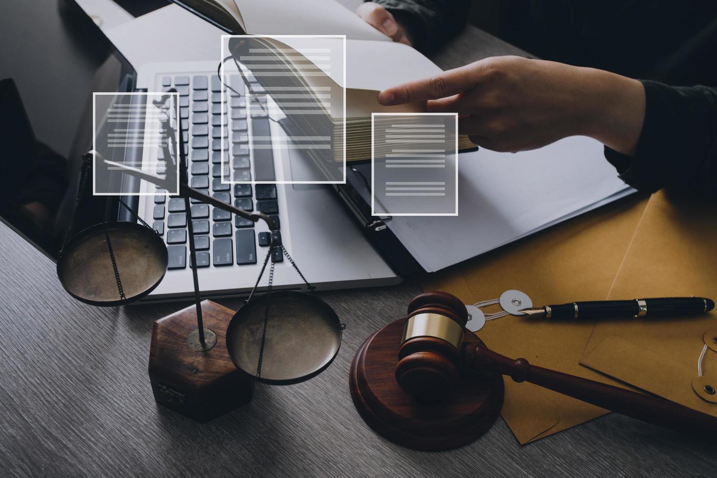 Male lawyer working with contract papers and wooden gavel on tabel in courtroom. justice and law ,attorney, court judge, concept. photo