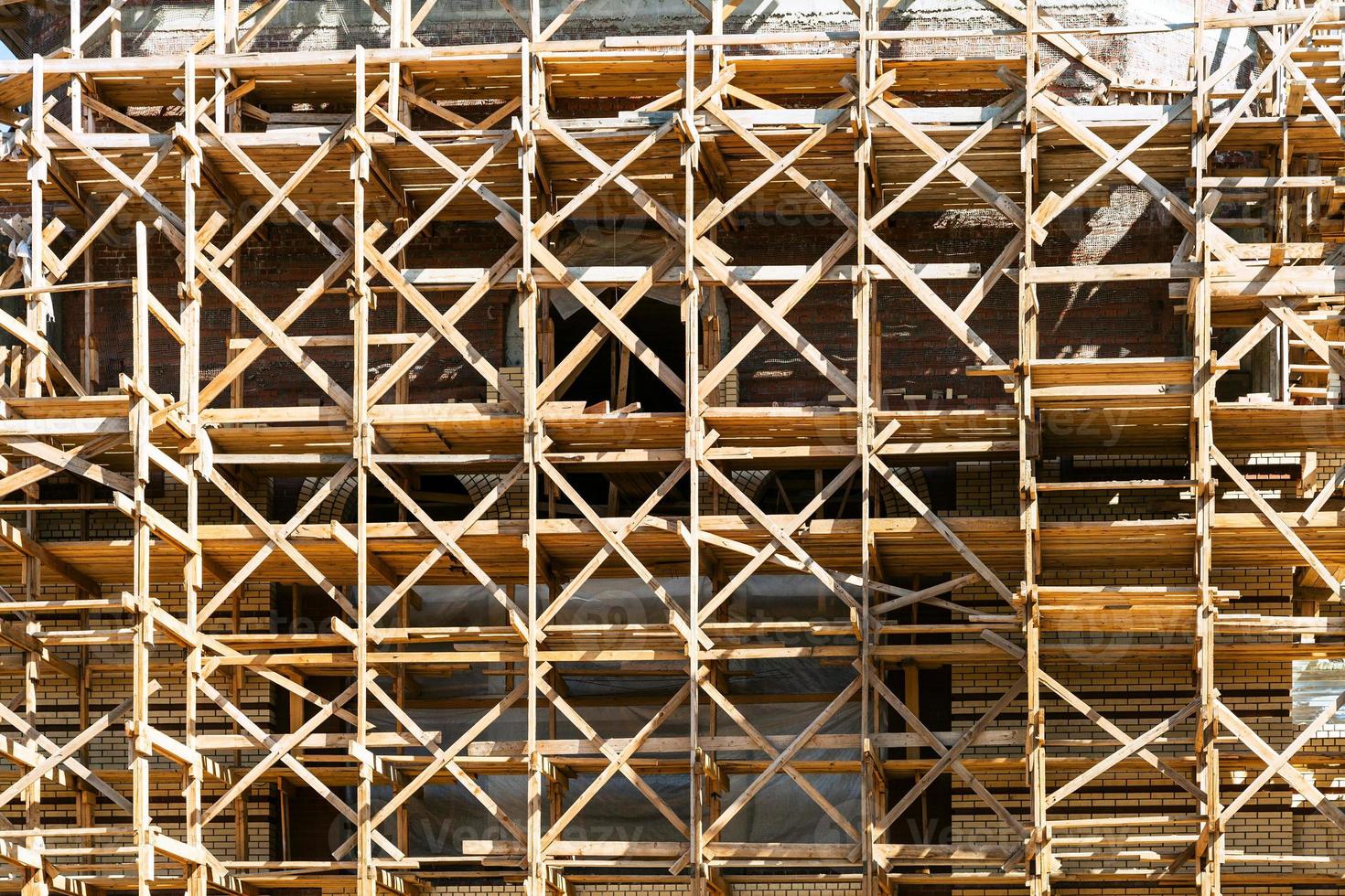 wooden scaffolds on multi-storey building photo