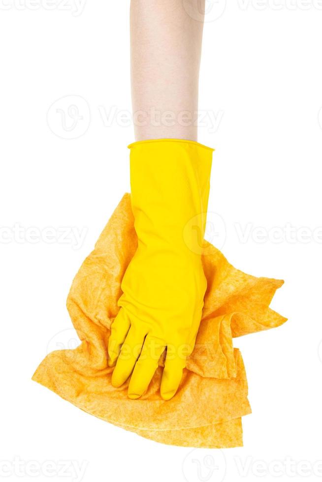 hand in yellow glove wipe with crumpled yellow rag photo