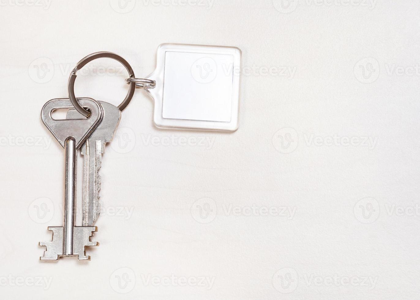 door keys on keyring with blank white keychain photo