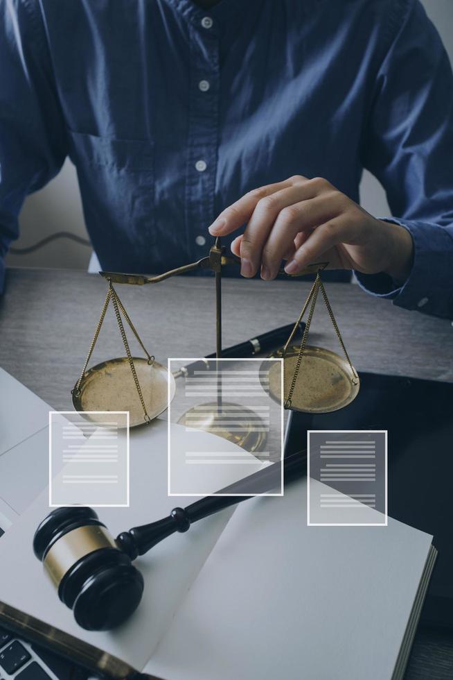 Male lawyer working with contract papers and wooden gavel on tabel in courtroom. justice and law ,attorney, court judge, concept. photo