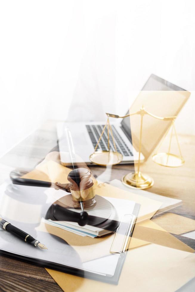 Business and lawyers discussing contract papers with brass scale on desk in office. Law, legal services, advice, justice and law concept picture with film grain effect photo
