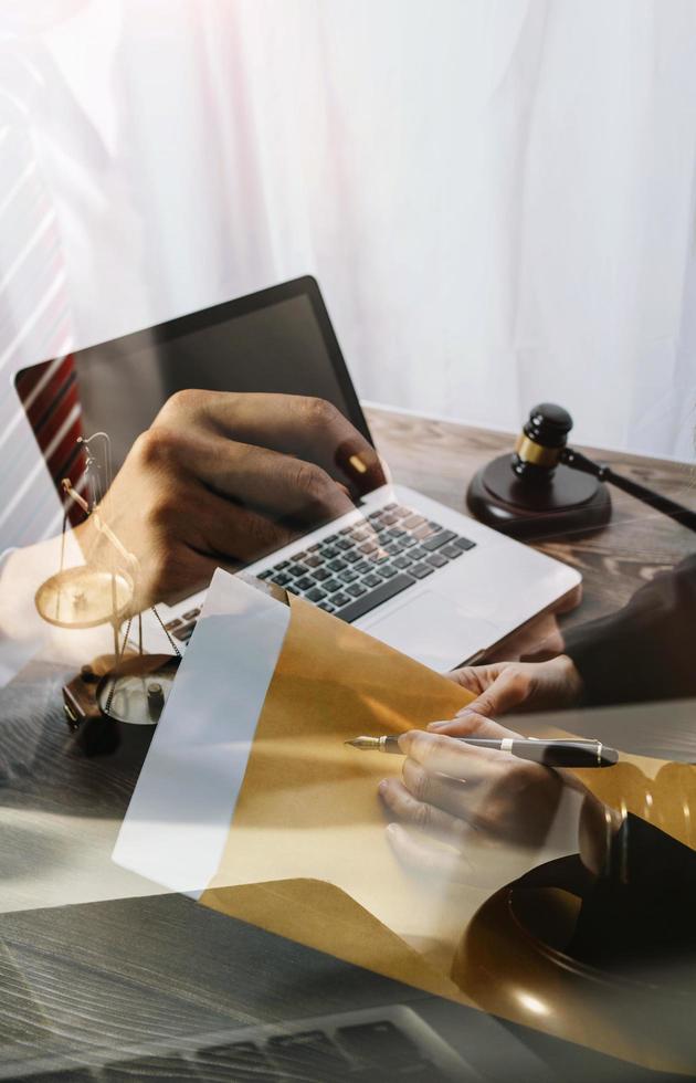 Business and lawyers discussing contract papers with brass scale on desk in office. Law, legal services, advice, justice and law concept picture with film grain effect photo