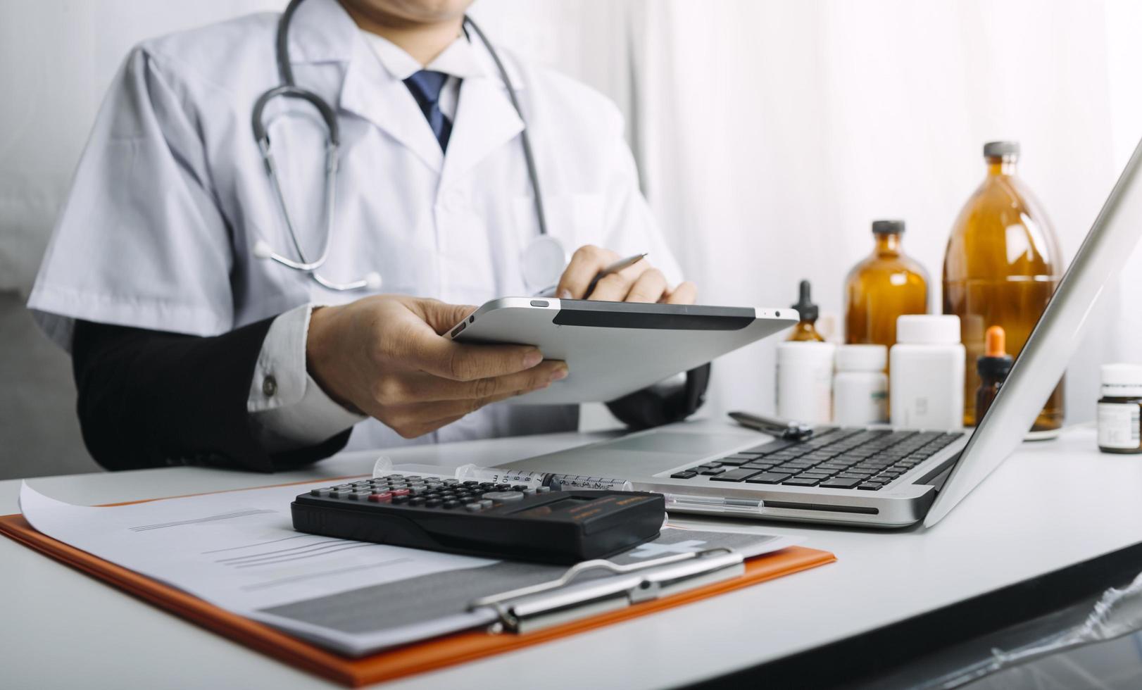 Medicine doctor hand working on a patients x-ray scans digital healthcare and connection with modern virtual screen interface icons, Medical technology and network concept. photo
