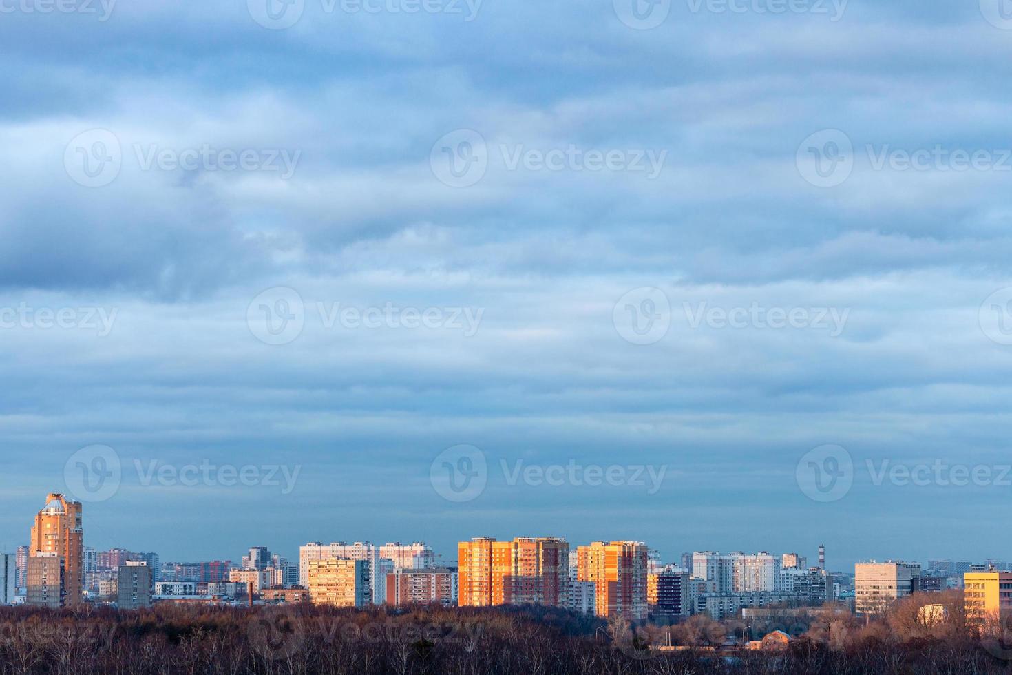 blue clouds over residential district in evening photo