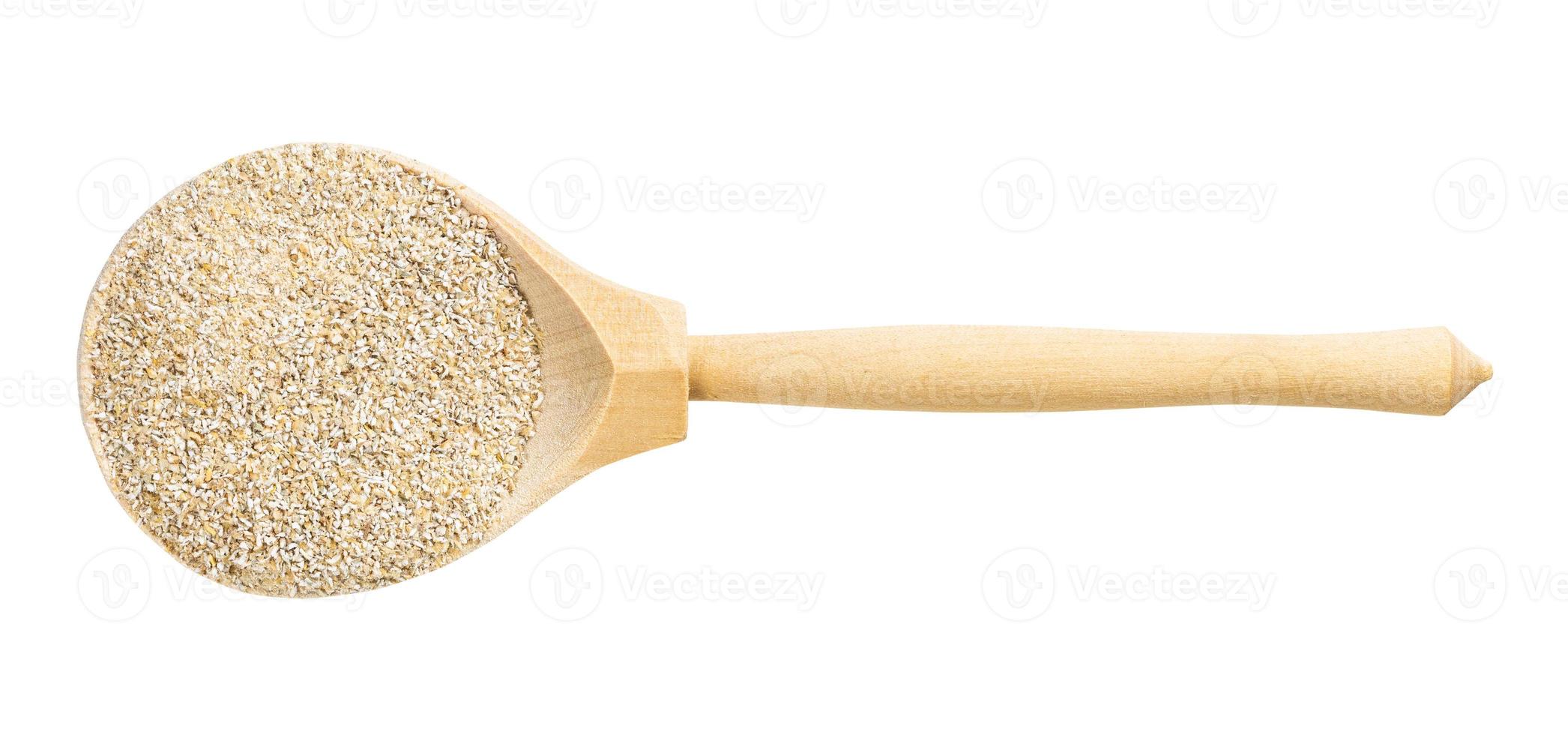 top view of wood spoon with rye bran isolated photo