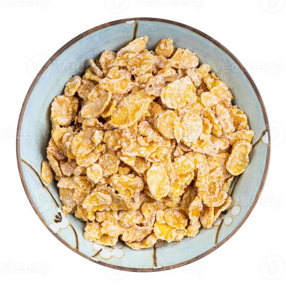 sugar coated cornflakes in round bowl isolated photo