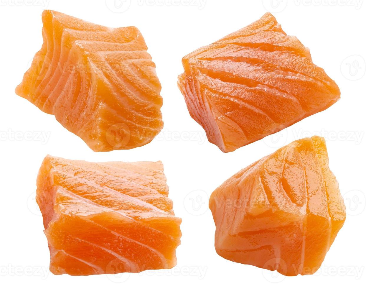 Salmon slices isolated on white background with clipping path, cubes of red fish photo