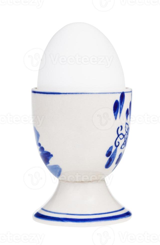white boiled egg in cup with a pointy end up photo