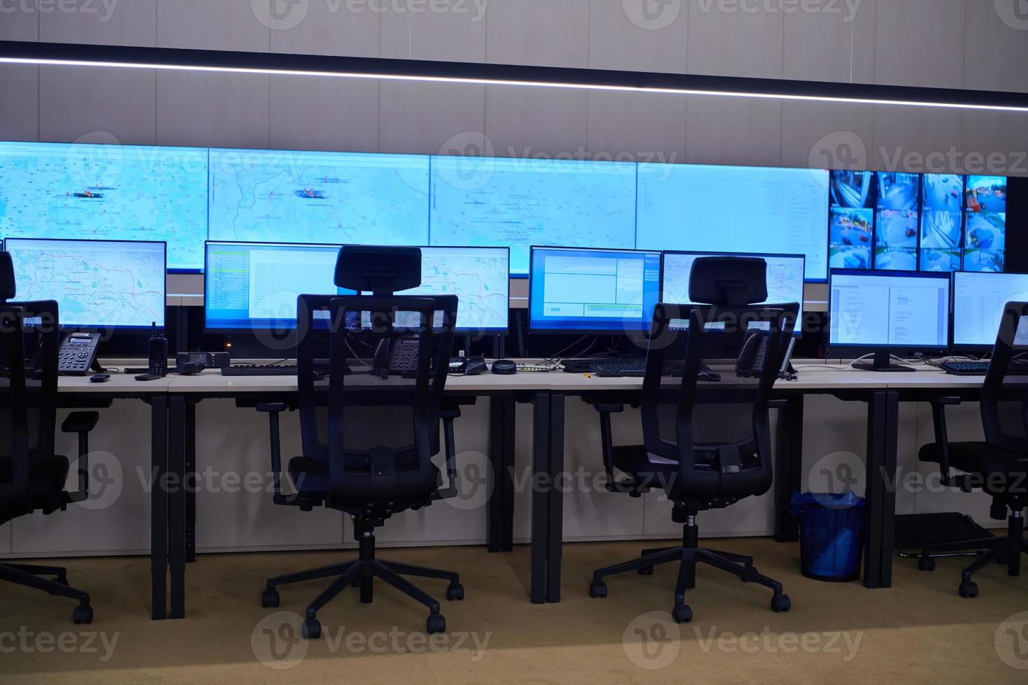 Empty interior of big modern security system control room photo