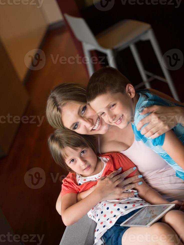 Young Family Using A Tablet To Make Future Plans photo