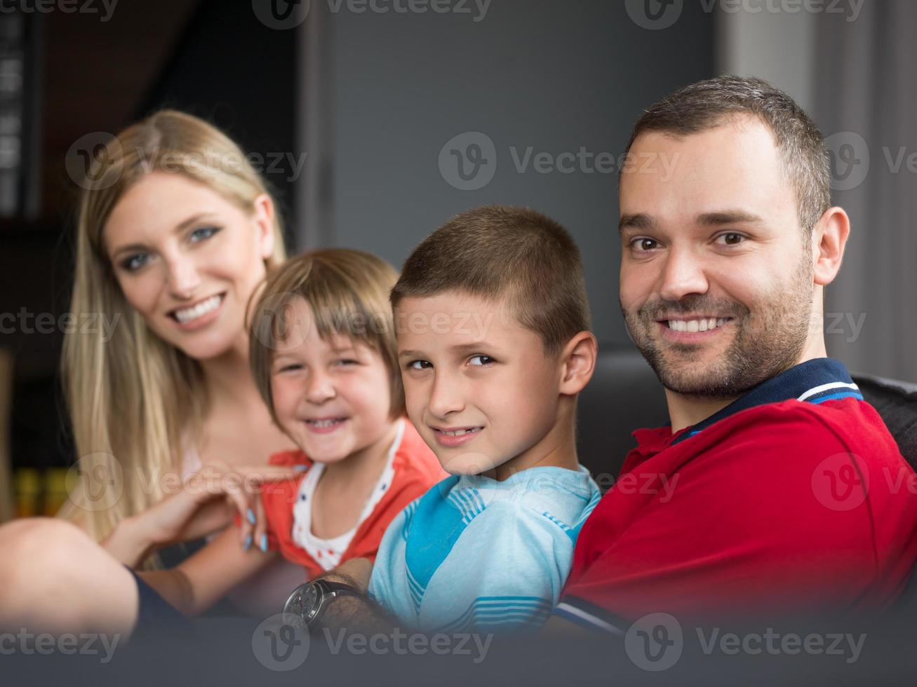 young cuple spending time with kids photo
