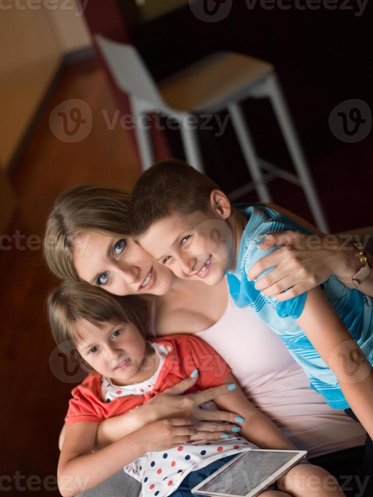 Young Family Using A Tablet To Make Future Plans photo