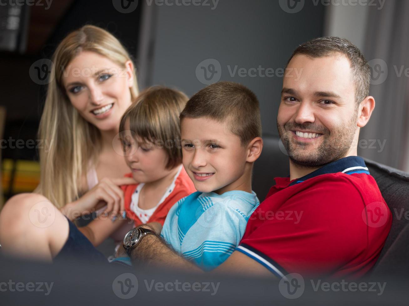 young cuple spending time with kids photo