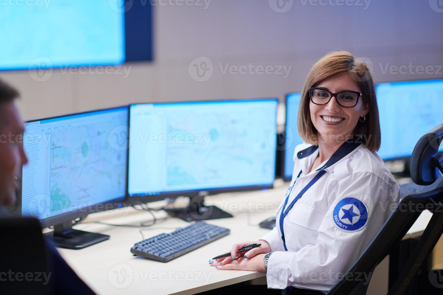 portrait of Female operator in a security data system control room photo