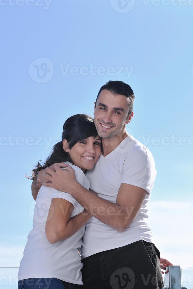 couple relaxing on balcony photo