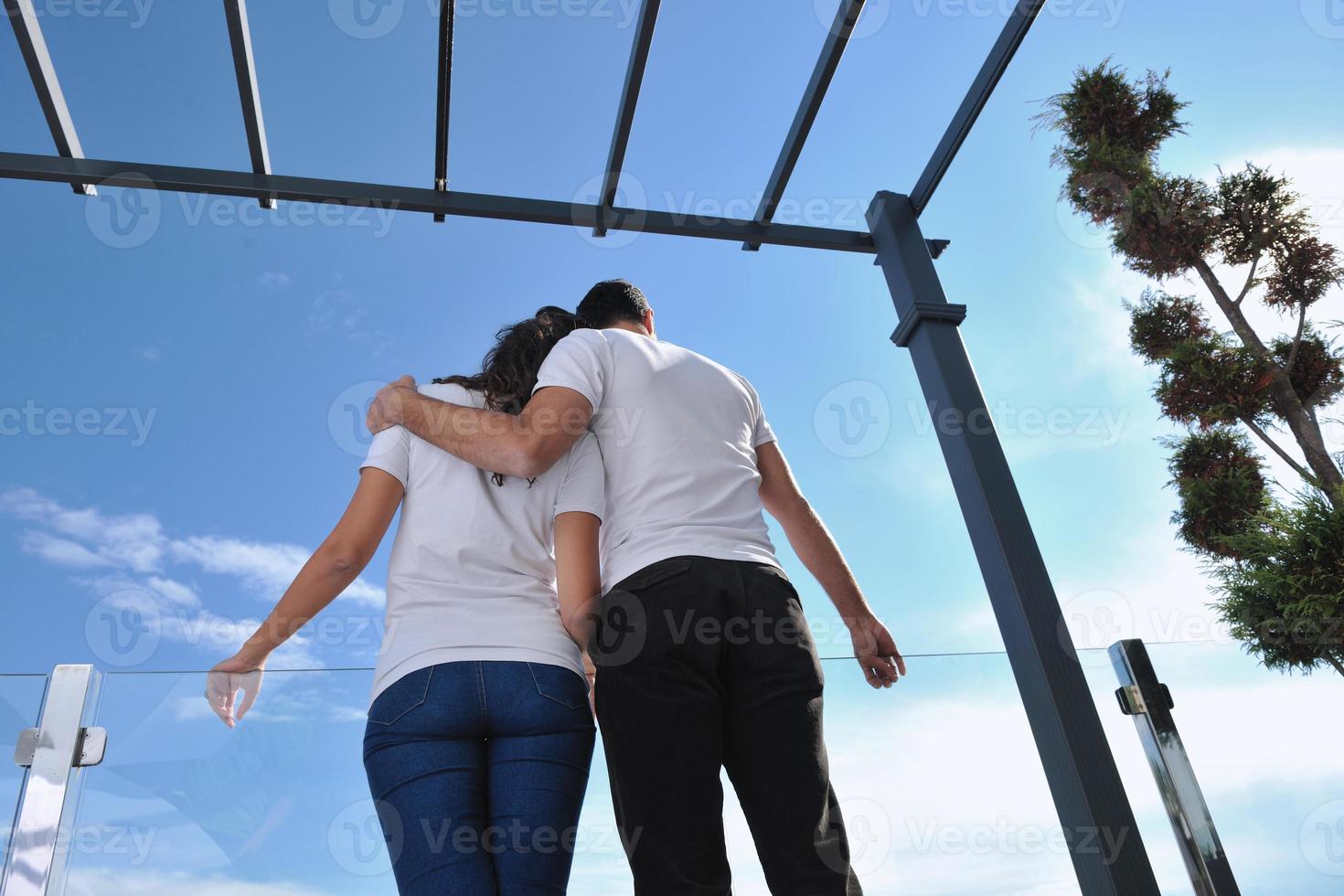couple relaxing on balcony photo