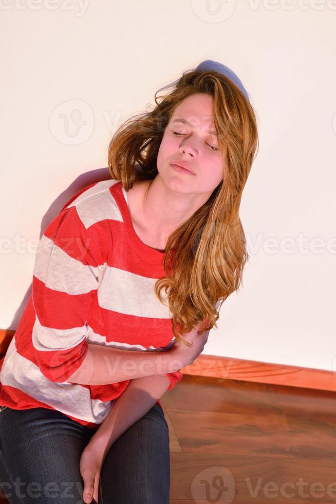 relaxed young man at home on balcony photo