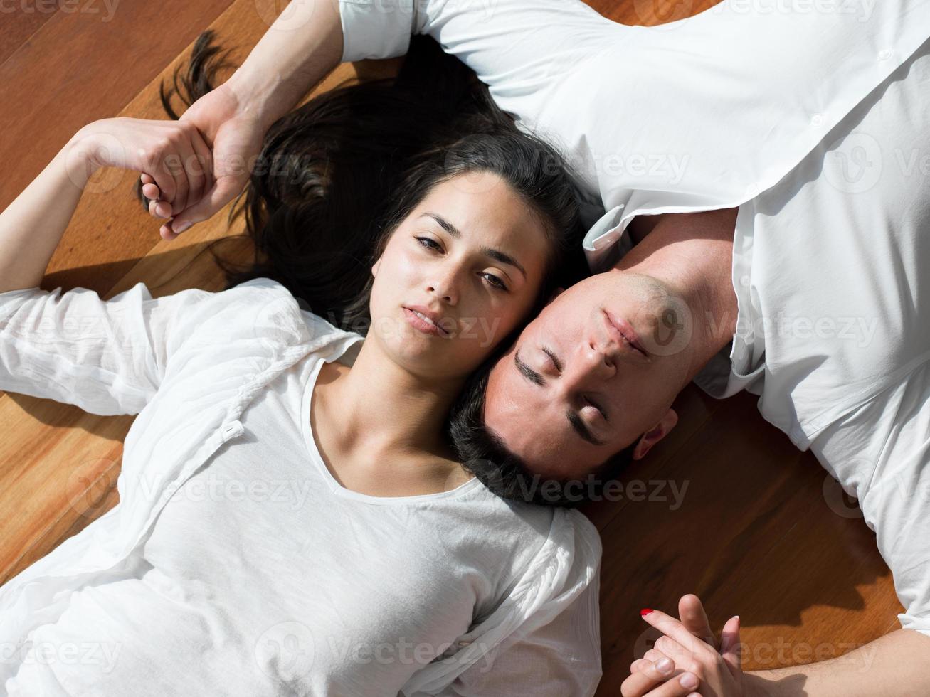 relaxed young couple at home photo