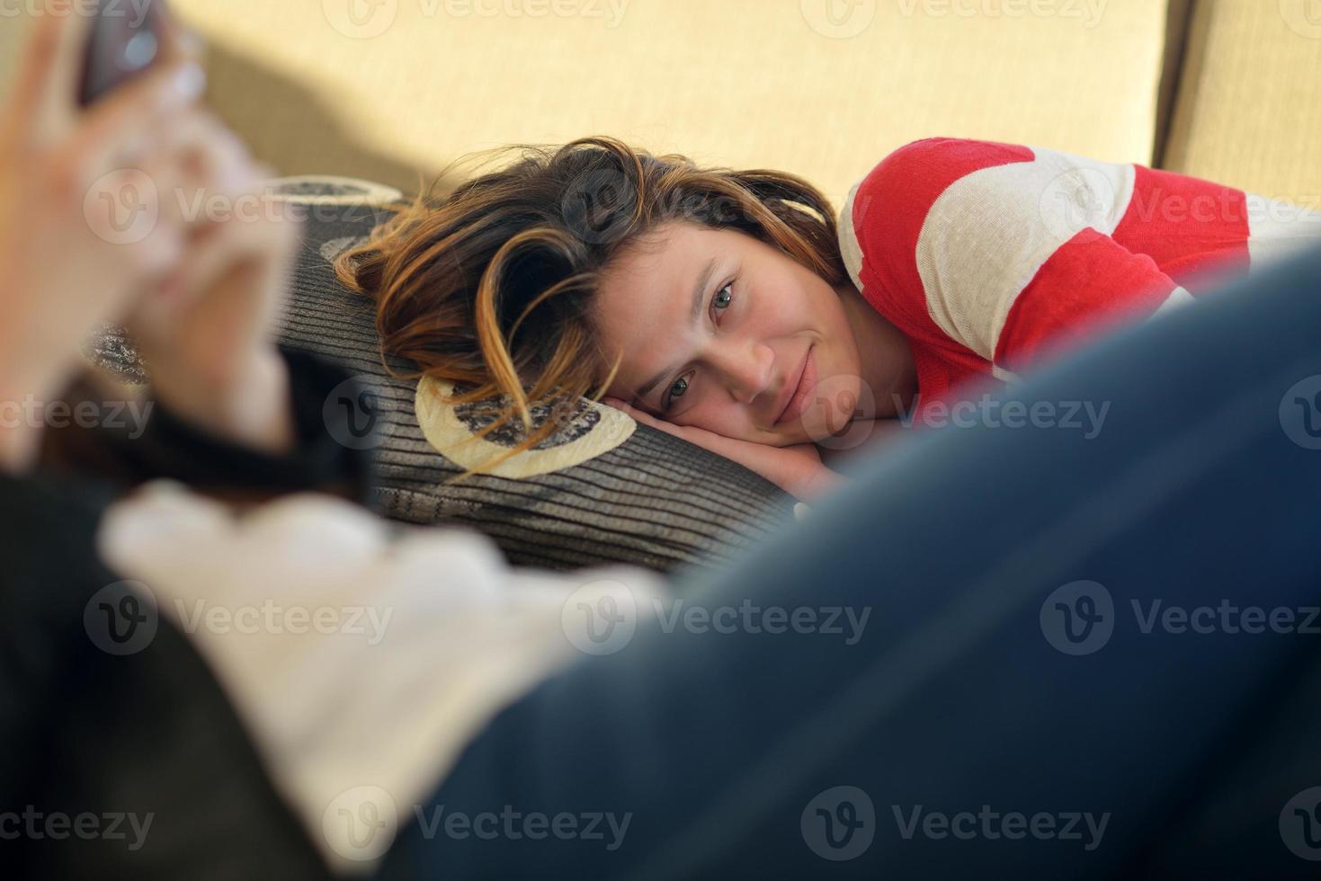 relaxed young woman at home photo