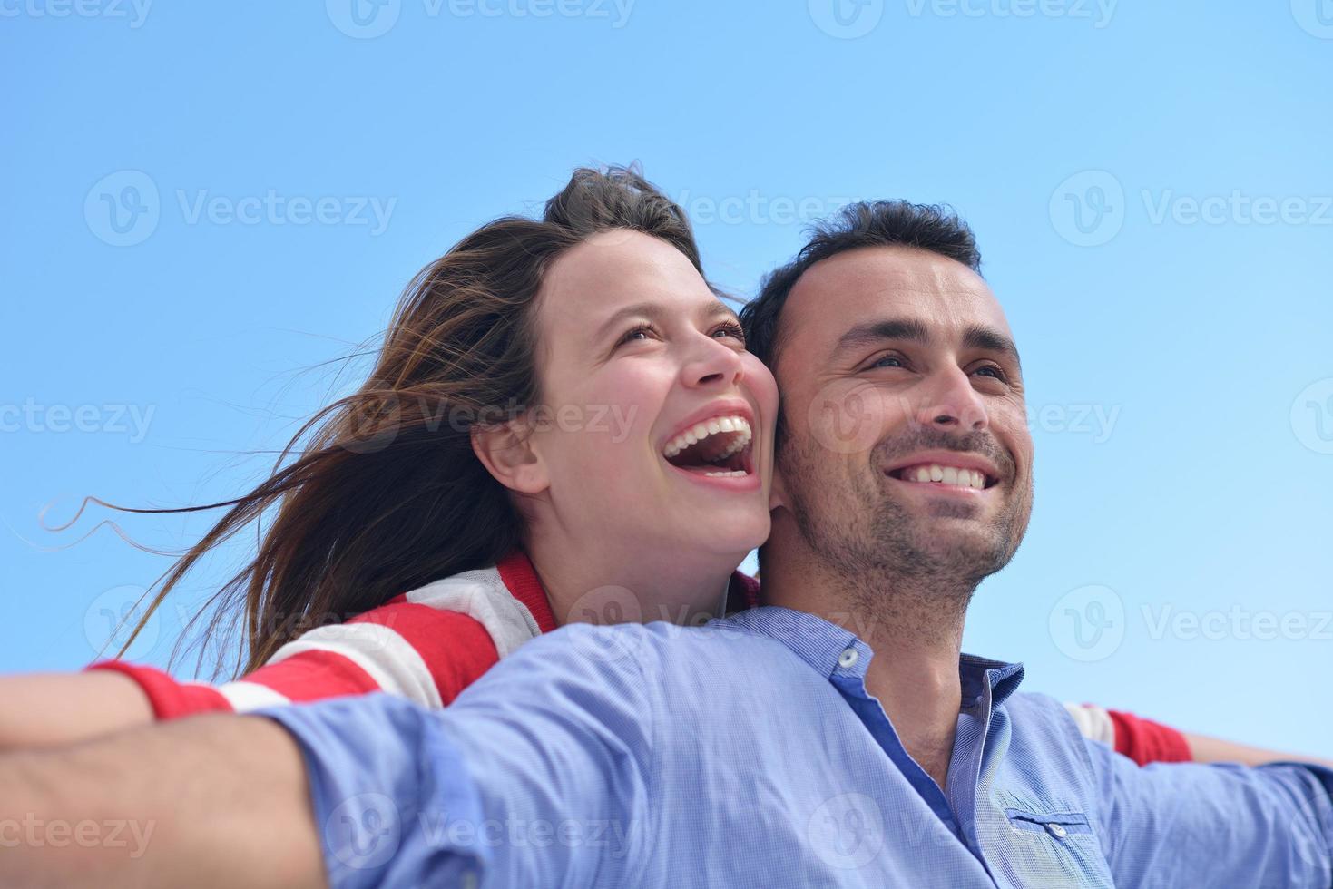 happy young romantic couple have fun relax photo