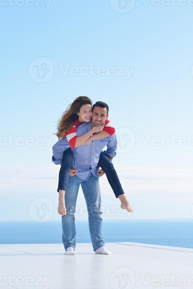 happy young romantic couple have fun relax photo