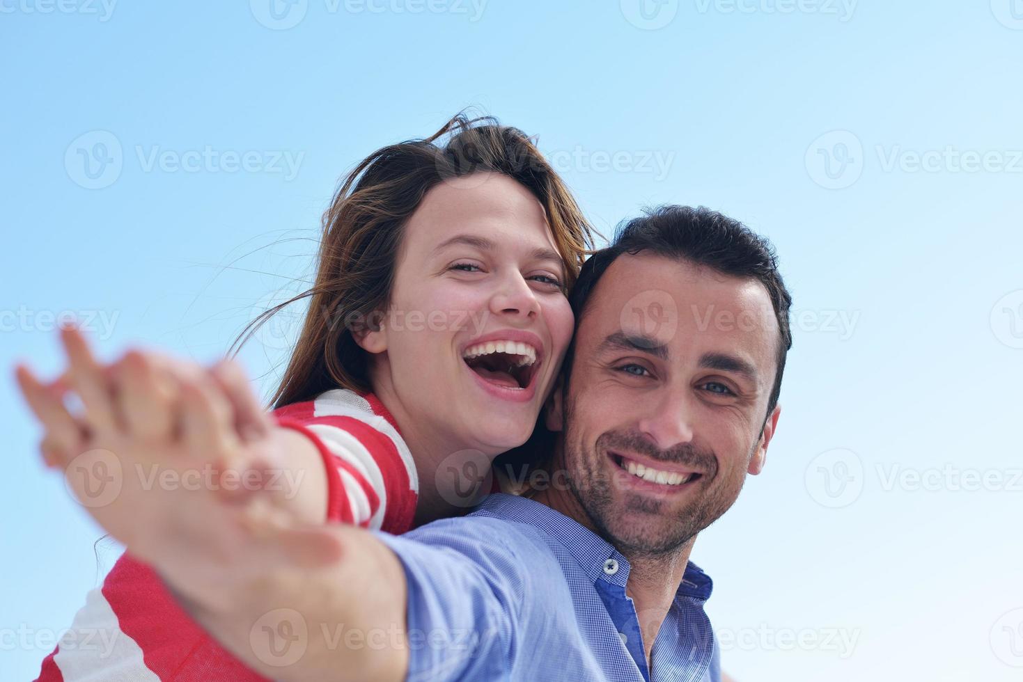 happy young romantic couple have fun relax photo