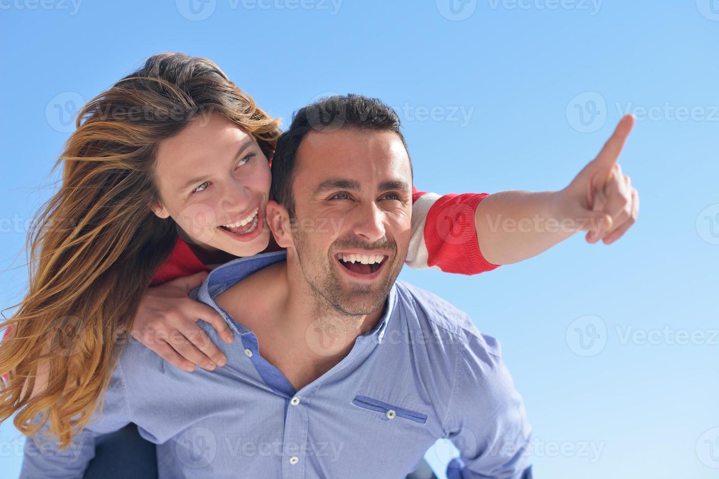 happy young romantic couple have fun relax photo