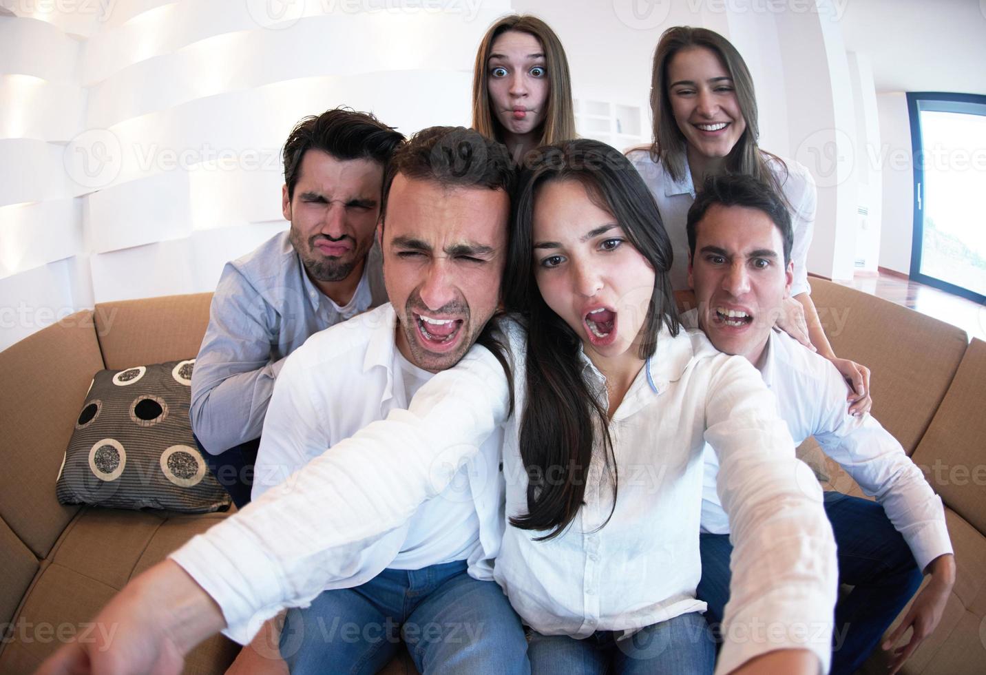 group of friends taking selfie photo