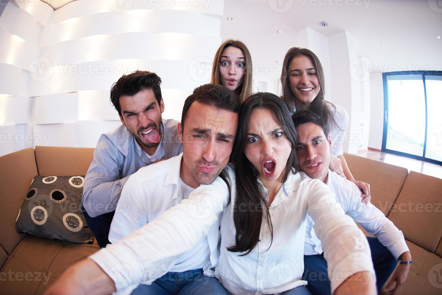 group of friends taking selfie photo